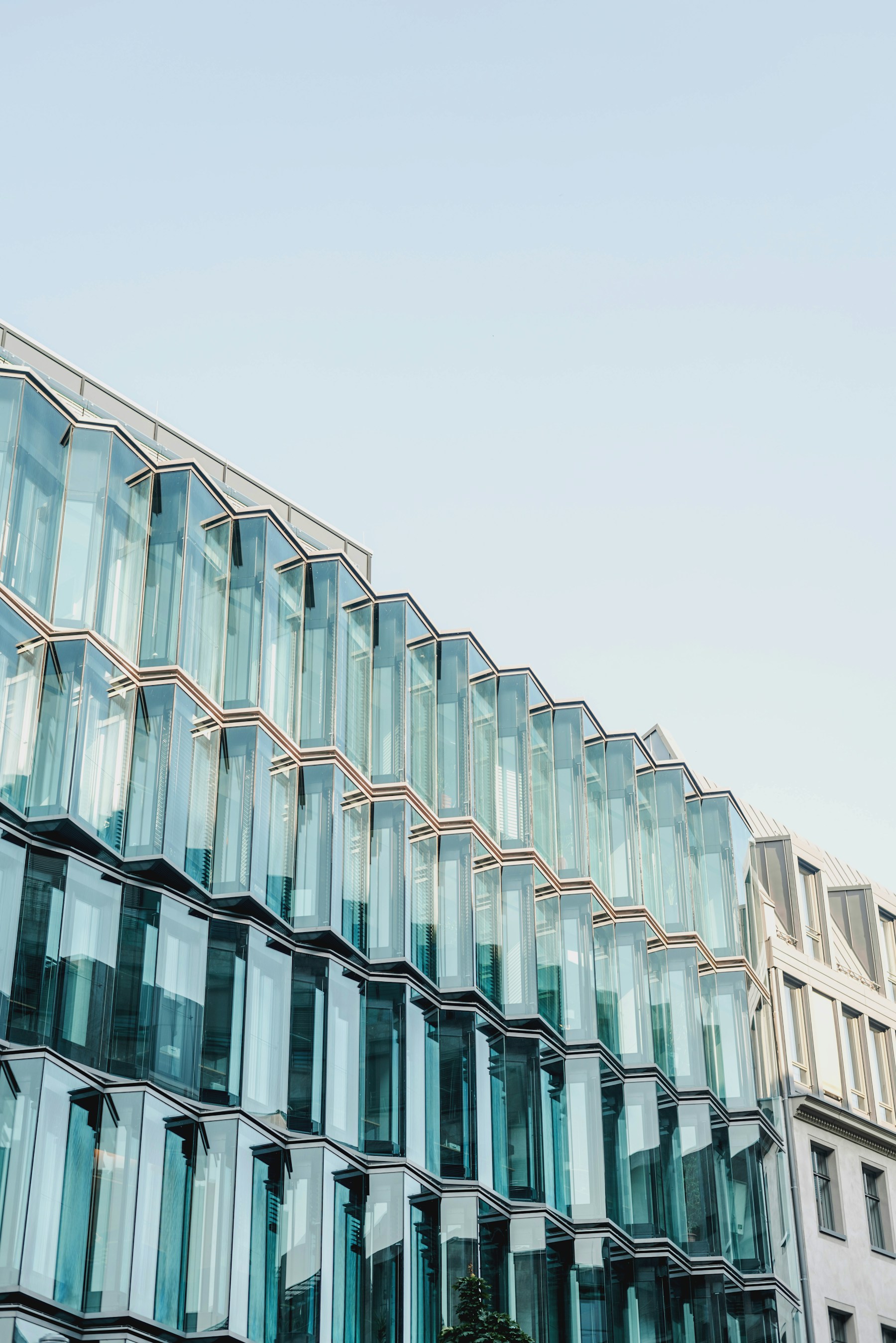 Sunlit contemporary architecture in Berlin, looking upwards towards an open sky.